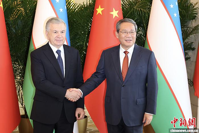 李强会见乌兹别克斯坦总统米尔济约耶夫